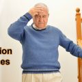 Fall prevention exercises. Senior man unsteady on the stairs.